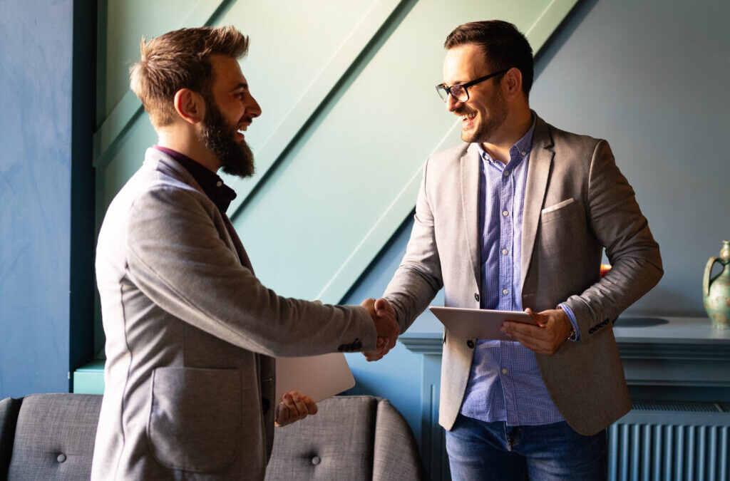 Handshake between two males in a business setting