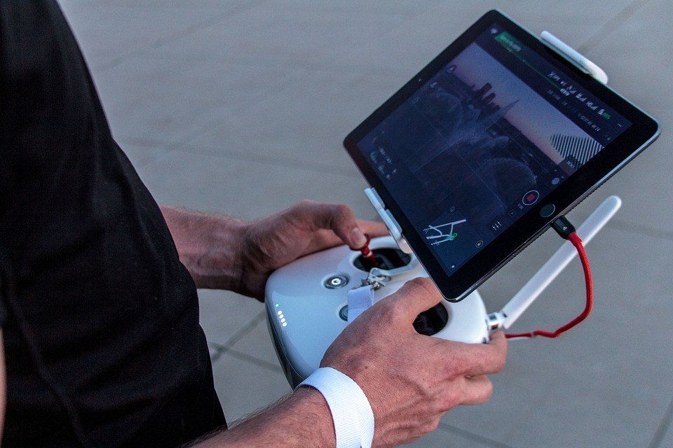 Person holding Drone remote