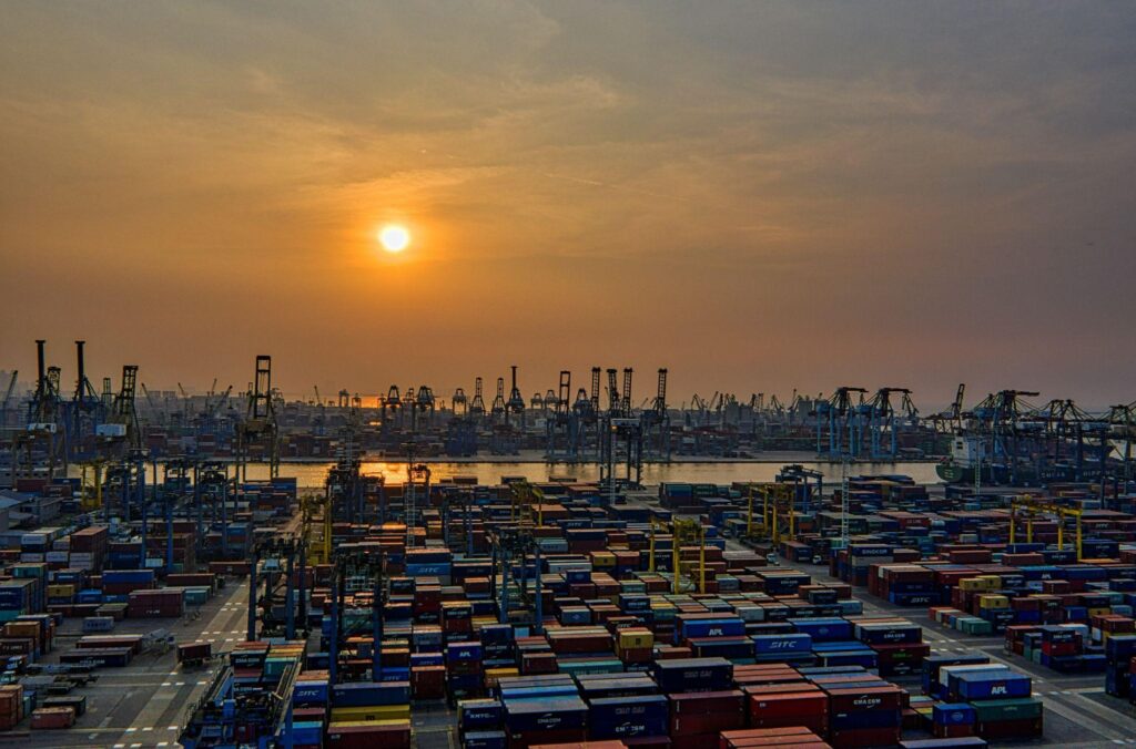 Sunset at an industrial Ship Yard with Shipping Containers