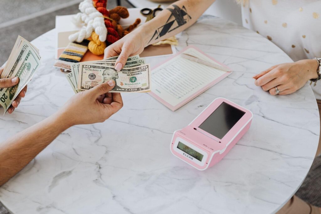 Handing over cash in retail store
