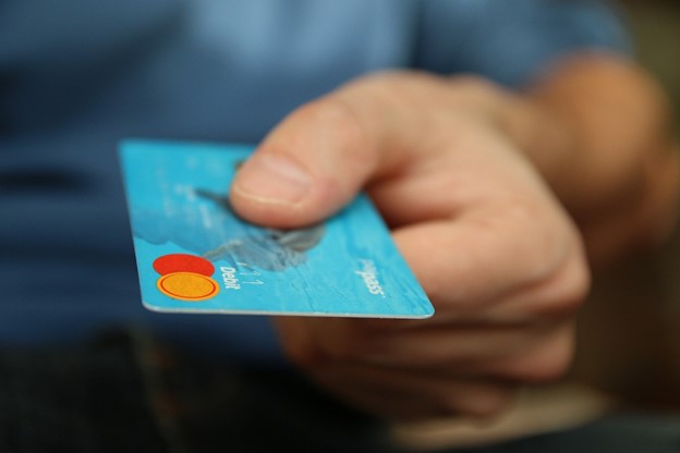 Handing over a Citi Bank Credit Card